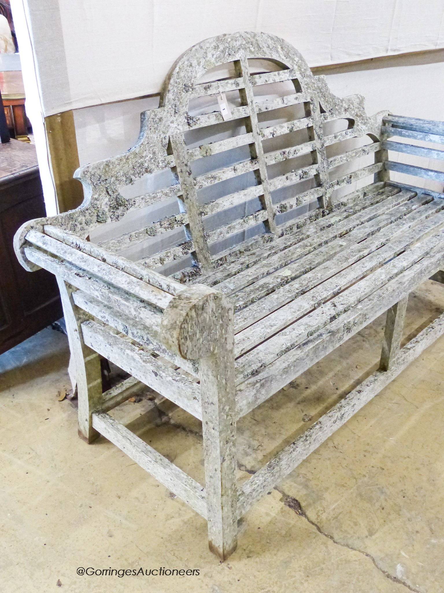 A weathered teak Lutchens style garden bench, length 166cm, depth 57cm, height 100cm